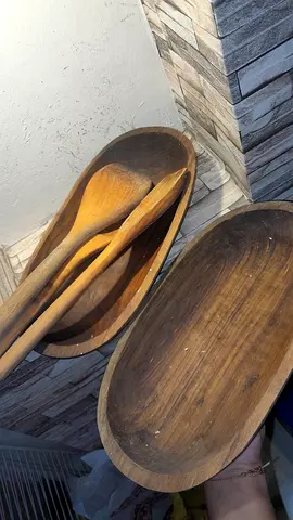 Set of wooden serving bowls with wooden spoons - used