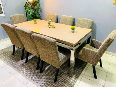 Cream upholstered 8-seater dining table set with chrome legs