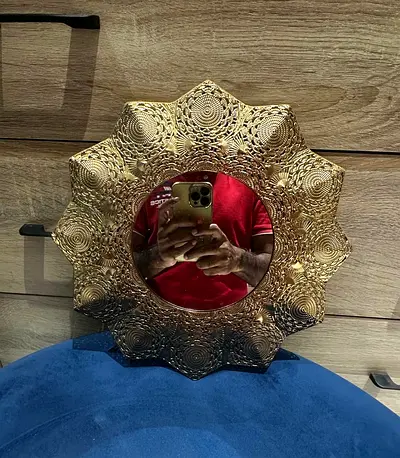 Decorative gold sunburst wall mirror - ornate round design