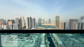 For rent: a two-bedroom apartment with a living room, overlooking Al Qasbaa Canal and Al Mamzar Lake