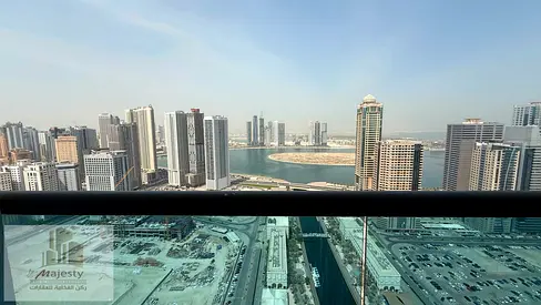 For rent: a two-bedroom apartment with a living room, overlooking Al Qasbaa Canal and Al Mamzar Lake