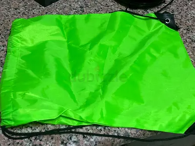 Bright green drawstring backpack — lightweight gym bag