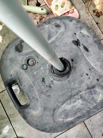 MOVING OUT SALE: Outdoor umbrella base stand (heavy plastic)