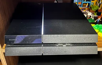PS 4 console with two controllers and games