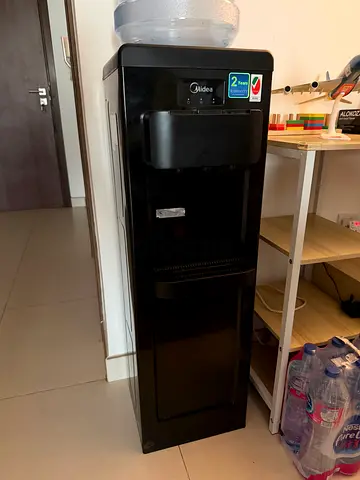 Black freestanding water cooler/dispenser - good working condition