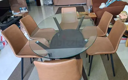 Glass Top Dining Table with 6 Brown Upholstered Chairs