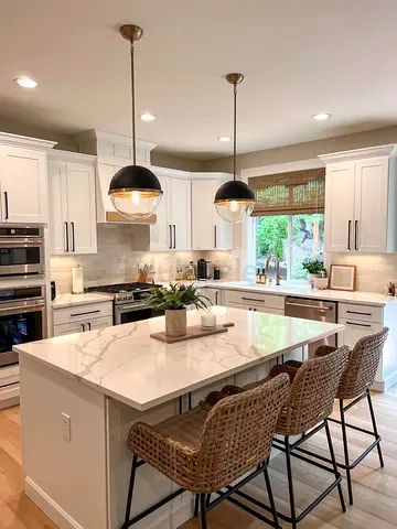 Modern white kitchen island with marble top and storage