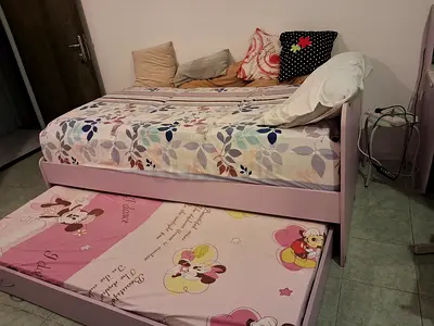 Purple wooden single bed with trundle - good condition