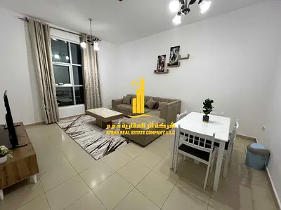 Luxury apartment, second occupancy, two bedrooms, living room, and open balcony. Ajman City Tower. Fully furnished, for monthly rent.