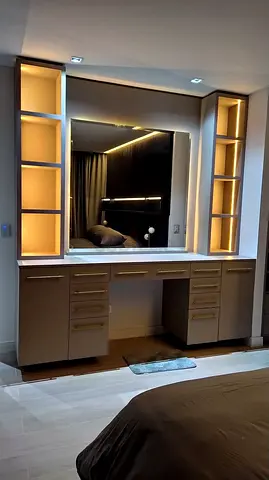 Built-in illuminated dressing table with storage and large mirror