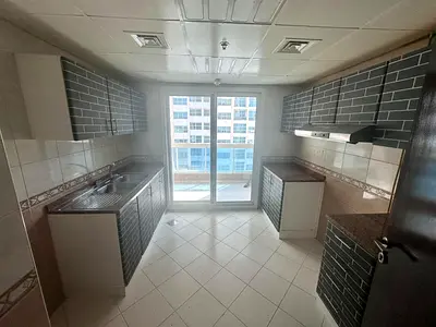 Two-bedroom apartment with a living room available for rent in Al Rashidiya 3, with three bathrooms and a laundry room.