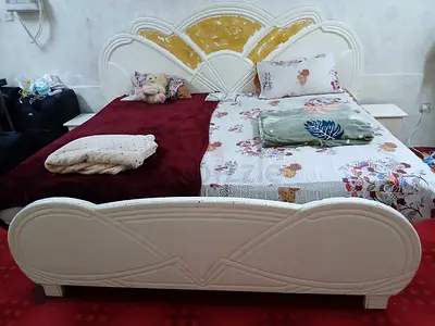 King size carved wooden bed with headboard and footboard - cream