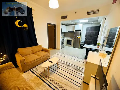 استوديو مفروش للايجار الشهري مع جيم ومسبح وشامل فواتير في برج الساعة  الراشدية 1 بموقع مميز قريب من سفير مول وجمعية أسواق عجمان