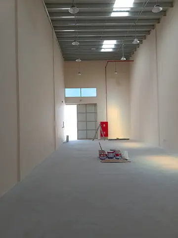A complex of 6 warehouses located in Al Jurf Industrial Area. Each warehouse has an area of 3,000 square feet, with a mezzanine to be constructed.