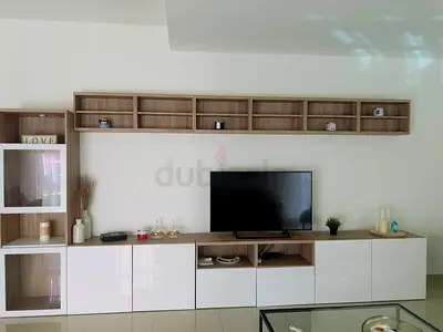 Modern wall-mounted entertainment unit with storage cabinets
