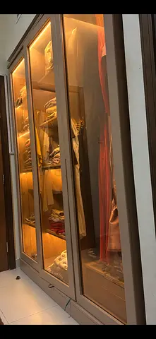 Three-door glass front wardrobe in beige — good condition almost new