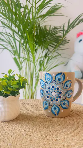 Hand-painted ceramic mug with blue mandala design