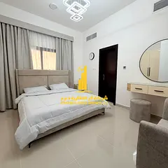 Luxurious two-bedroom apartment with a living room and open views in Ajman - Corniche - furnished wi
