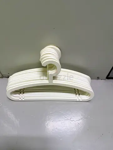 Pack of white plastic clothes hangers - 10 pieces