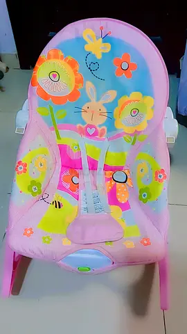 Pink baby bouncer / rocker with playful animal print