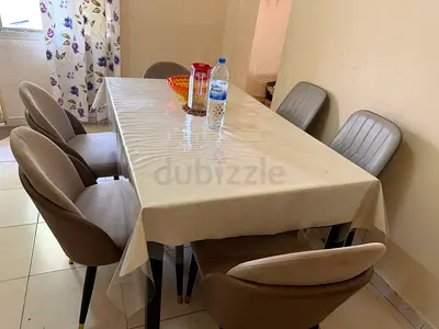 Dining table with 6 upholstered chairs - good condition