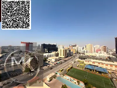 شقة واسعة للبيع: غرفتا نوم + غرفة خادمة | أبراج النعيمية، عجمان | موقع متميز
