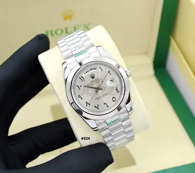 Rolex Oyster Perpetual stainless steel watch with Arabic numerals