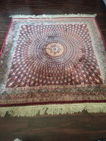 Maroon carpet with intricate design