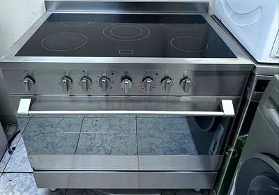 Large stainless steel electric range with ceramic hob and double oven