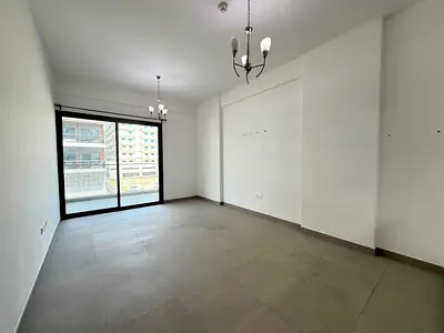 Modern 1BR | Balcony with Open View | Warsan 4