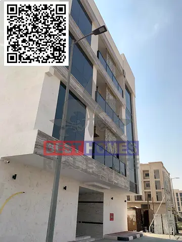 Residential Building – Tilal City Freehold for all Nationalities modern building with stable, contract-based rental income.