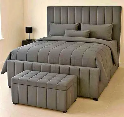 Grey upholstered king-size bed frame with storage bench - modern design
