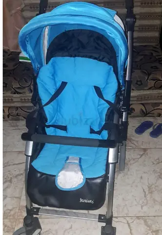 Light blue baby stroller in good used condition