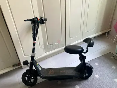 Electric seated scooter for children