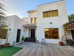 Villa in Al Rawda 1 consisting of five bedrooms, a maid's room, a living room, and a majlis, with an