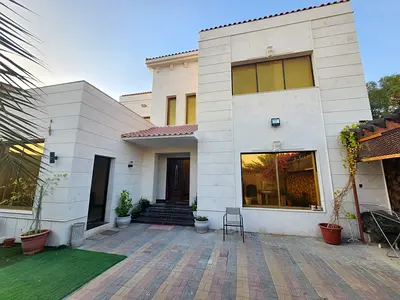 Villa in Al Rawda 1 consisting of five bedrooms, a maid's room, a living room, and a majlis, with an area of ​​5,000 sq ft