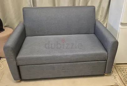Compact 2-seater grey fabric sofa bed - good condition