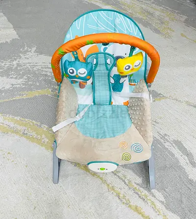Baby bouncer / rocker seat with toy bar - gently used Firstcry