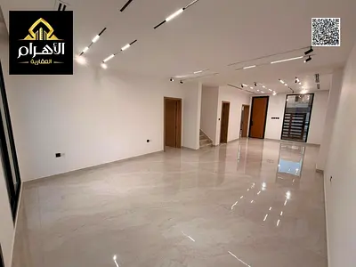 Villa for sale, including registration and ownership fees, near all services, close to Sheikh Mohammed Bin Zayed Road, on a main street, very prime lo