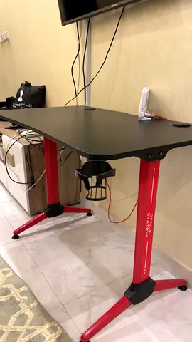 Compact gaming/office desk with cup holder — black top, red legs