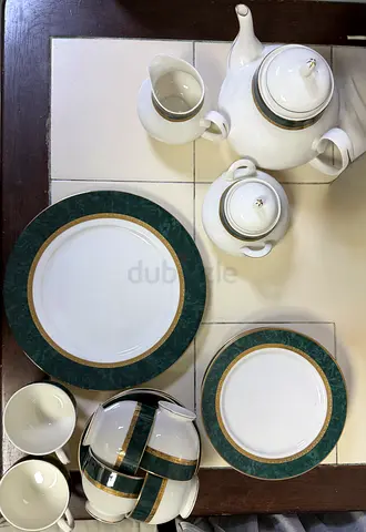 White porcelain tea set with green and gold trim