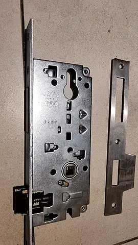 Used mortise door lock mechanism with strike plate - good condition