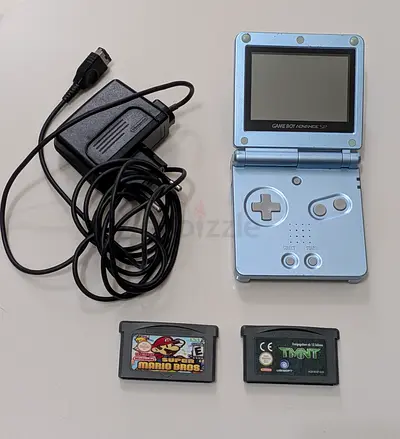 Nintendo Game Boy Advance SP with charger + 2 cartridges (Mario Bros, TMNT)