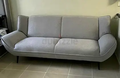 Light grey 3-seater fabric sofa in good condition (Abu Dhabi)