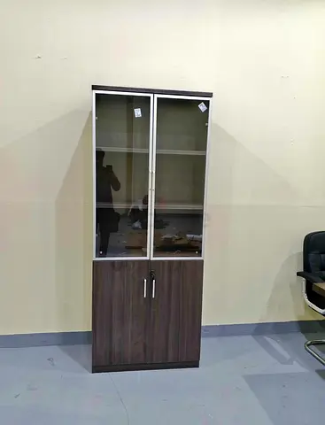 Tall wooden storage cabinet with glass display doors