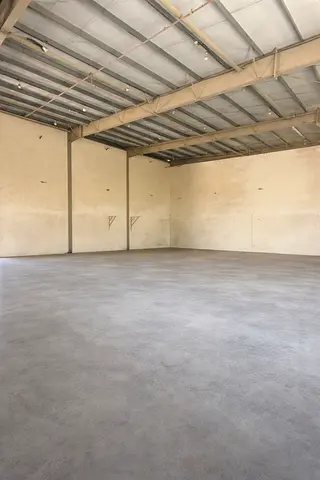 8000 sqft warehouse UAQ mezzanine 100KW AED 310K two main roads offices ready