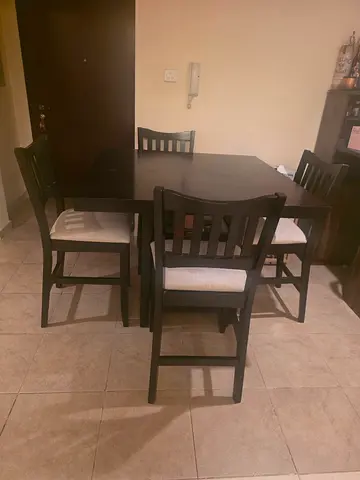 Solid dark wood 4seater dining table with cushioned chairs