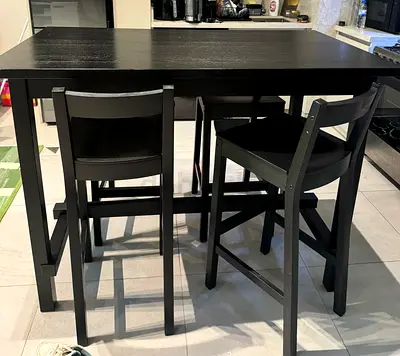 Black wooden dining table with 4 matching chairs - good condition