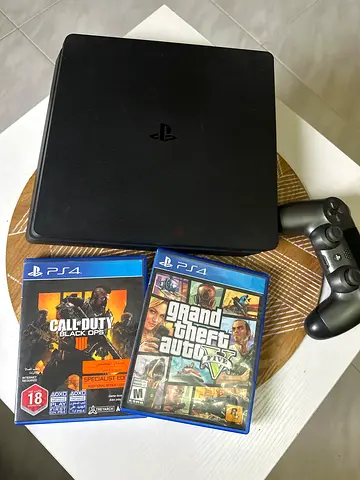 PlayStation 4 Slim with DualShock controller + 2 games (GTA V, CoD)