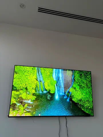 65-inch Samsung Smart TV - Wall mounted, good working condition
